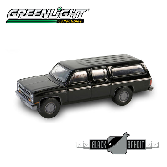 GREENLIGHT Black Bandit Series 29 - 1985 Chevrolet Suburban C10 Custom Deluxe 1:64 - 28150-D